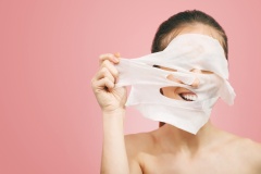 Woman Removes a Cleansing Mask