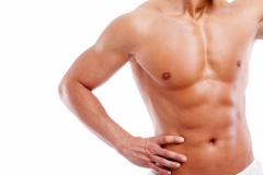 Muscular man in towel, isolated on white background