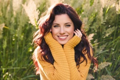 portrait of a beautiful woman in an autumn yellow sweater.
