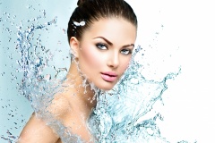 Beautiful model spa woman with splashes of water