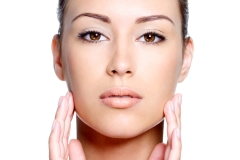 Front view of woman's face with healthy clean face